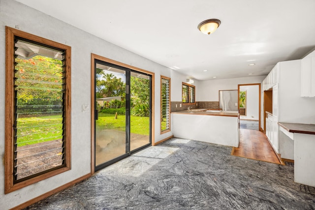 5611 Ohelo Rd, Kapaa, HI 96746 - kitchen featuring a peninsula and white cabinets