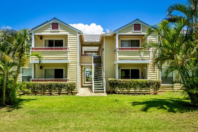 68-3831 Lua Kula St Unit G207, Waikoloa, HI 96738 - townhome / multi-family property with stairway, a front lawn, and a balcony