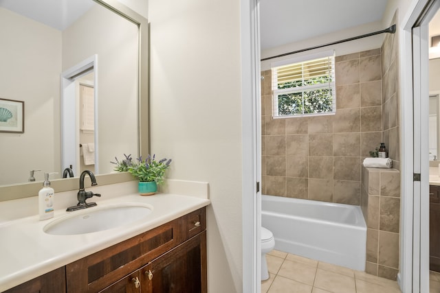 full bathroom with washtub / shower combination, toilet, tile patterned flooring, and vanity