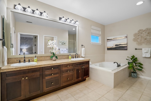 full bathroom featuring a stall shower, visible vents, a sink, and a bath
