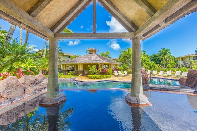 outdoor pool featuring a gazebo and a patio area