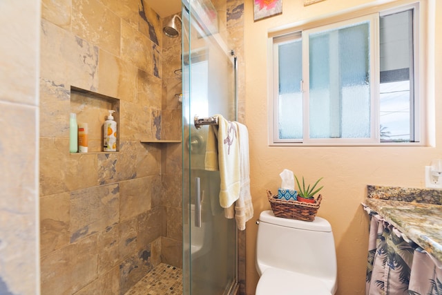 full bathroom featuring vanity, toilet, and a stall shower