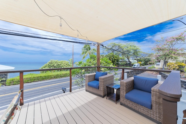 wooden deck featuring a water view
