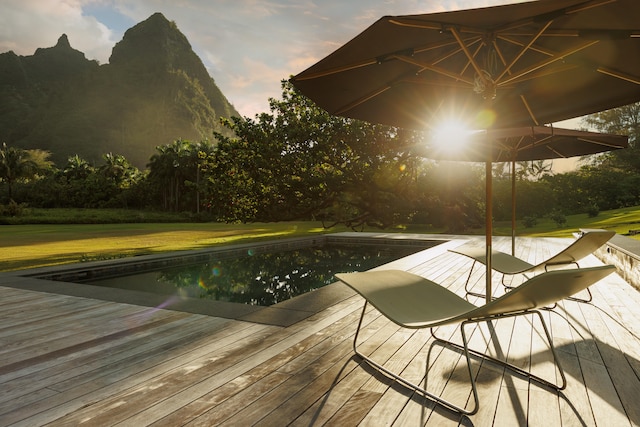 5-8192 Kuhio Hwy, Hanalei, HI 96714 - pool at dusk with a deck, a yard, and an outdoor pool