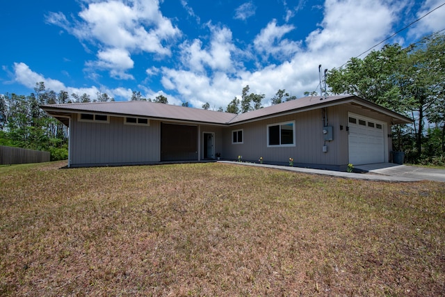 single story home featuring fence, concrete driveway, a front yard, and a garage