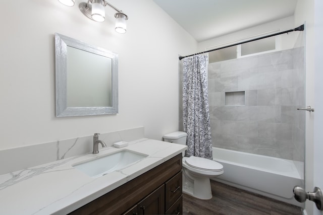 bathroom with shower / bath combo, wood finished floors, toilet, and vanity