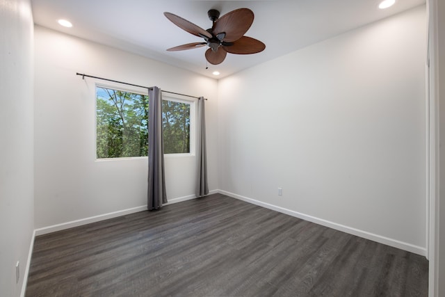 spare room with baseboards, recessed lighting, ceiling fan, and dark wood-type flooring
