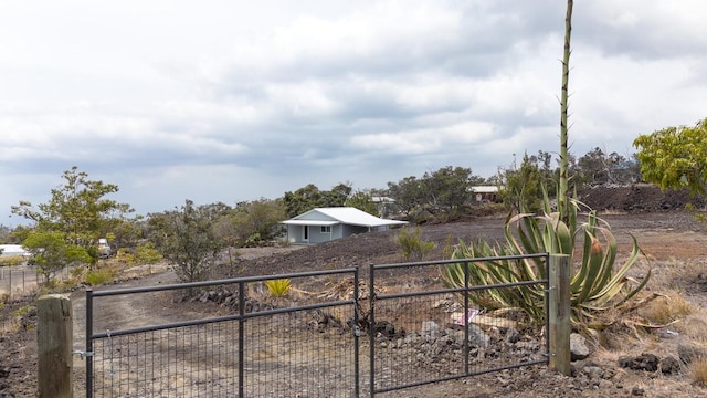 view of yard with fence and a gate
