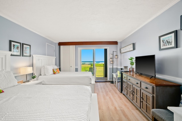 4331 Kauai Beach Dr Unit 4113, Lihue, HI 96766 - bedroom with light wood-type flooring, access to outside, and crown molding