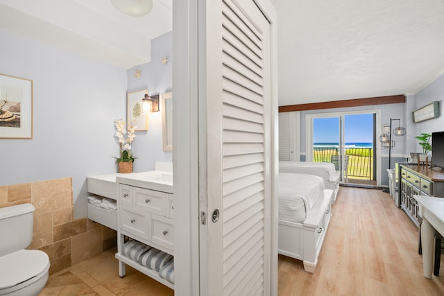 4331 Kauai Beach Dr Unit 4113, Lihue, HI 96766 - bathroom featuring toilet, vanity, and wood finished floors