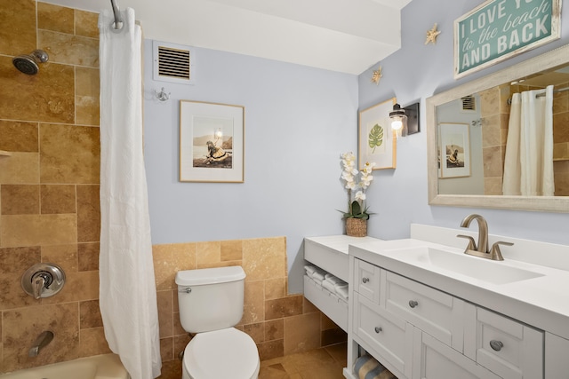 4331 Kauai Beach Dr Unit 4113, Lihue, HI 96766 - bathroom featuring tile walls, visible vents, toilet, and vanity