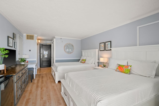 4331 Kauai Beach Dr Unit 4113, Lihue, HI 96766 - bedroom with visible vents, crown molding, and light wood-style floors