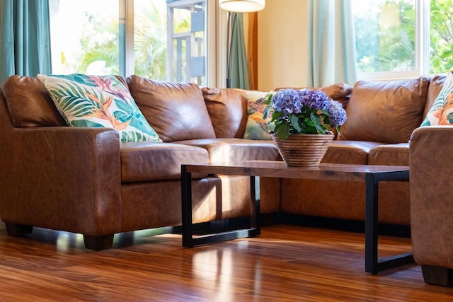 living area featuring plenty of natural light and wood finished floors