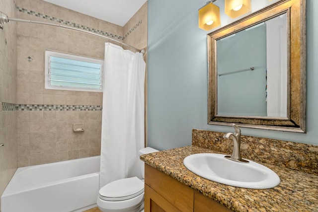 bathroom with toilet, shower / bath combo with shower curtain, and vanity