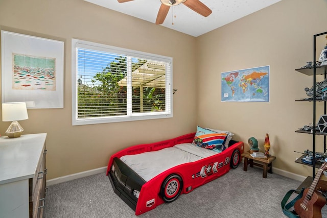 bedroom with carpet flooring, baseboards, and ceiling fan