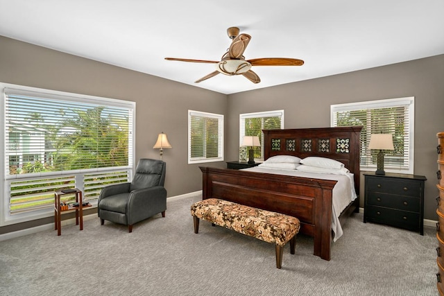 bedroom with baseboards, ceiling fan, and carpet