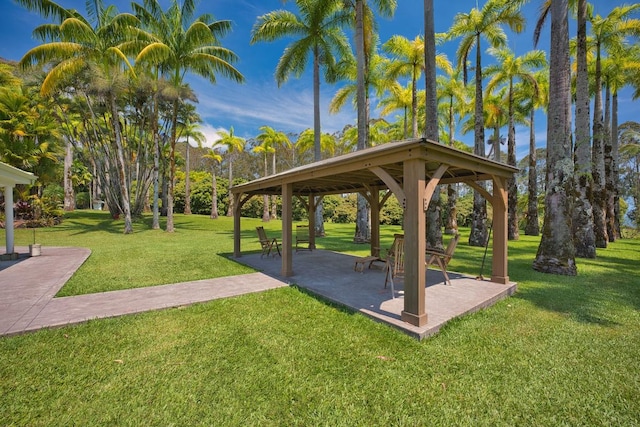 view of home's community with a gazebo and a yard