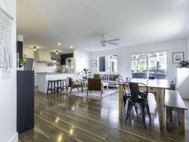dining space with dark wood finished floors, recessed lighting, and a ceiling fan