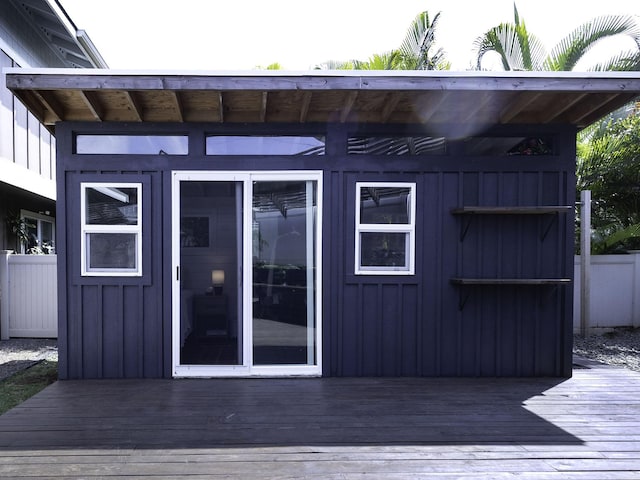 view of outbuilding with fence
