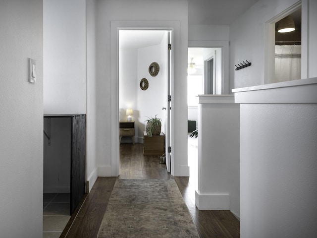 hall with wood finished floors