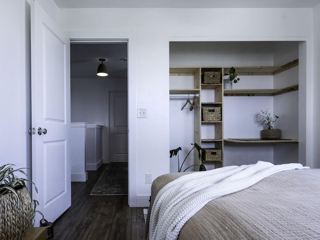 bedroom featuring dark wood-style floors