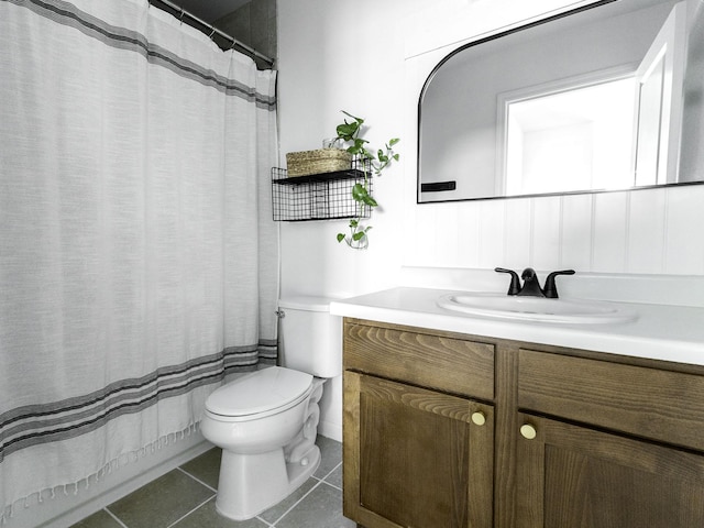 full bath featuring tile patterned floors, vanity, and toilet