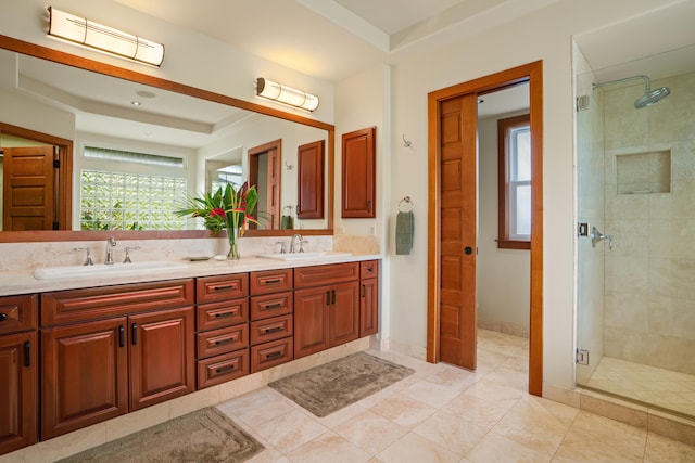 full bathroom featuring a stall shower, double vanity, and tile patterned floors