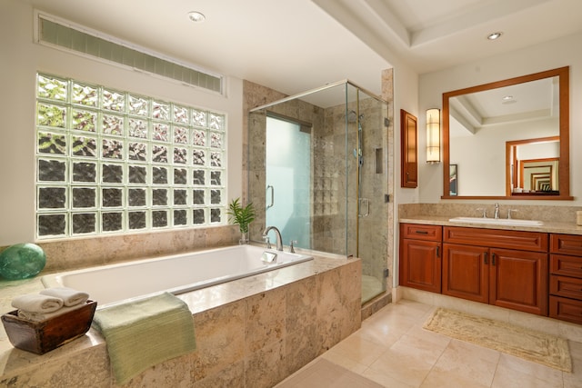 full bath featuring plenty of natural light, vanity, a garden tub, a stall shower, and recessed lighting