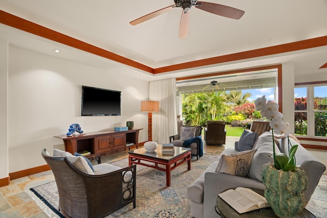 living area with ceiling fan, stone tile floors, baseboards, and recessed lighting