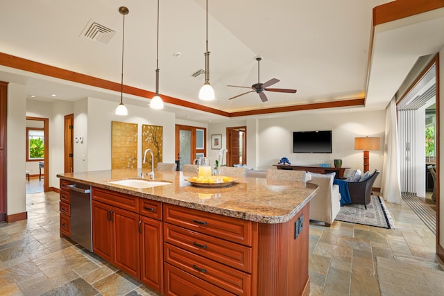 kitchen featuring stone tile flooring, a sink, dishwasher, a tray ceiling, and recessed lighting