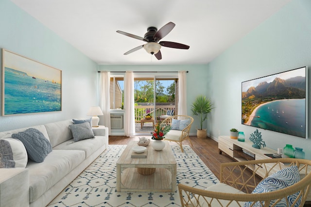 living room with ceiling fan, wood finished floors, and baseboards