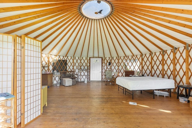 32-520 Piha Kahuku Rd, Ninole, HI 96773 - bedroom with wood-type flooring and lofted ceiling