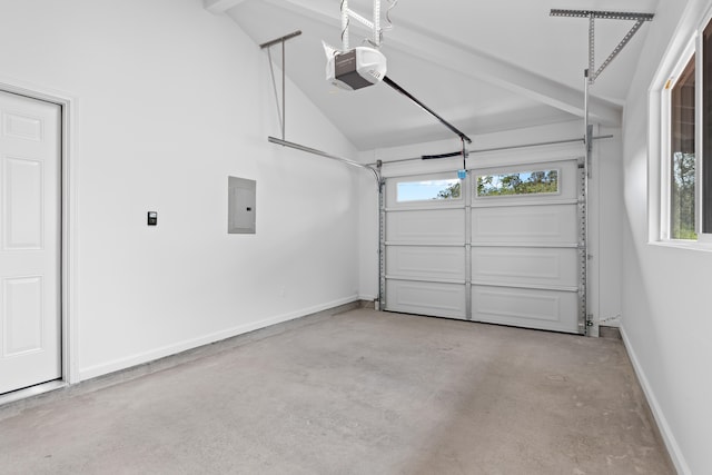 garage featuring a garage door opener, electric panel, and baseboards