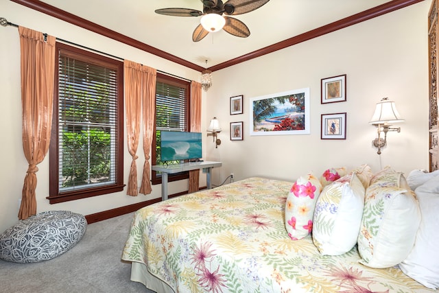 bedroom featuring baseboards, ornamental molding, a ceiling fan, and carpet flooring