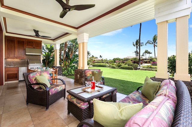 view of patio / terrace with an outdoor living space, a ceiling fan, a sink, and exterior kitchen