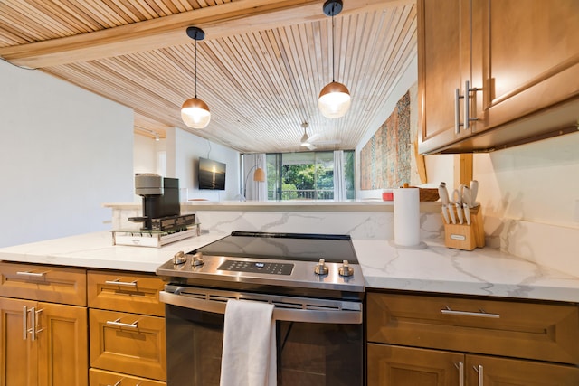1875 Kalanianaole Ave Unit 311, Hilo, HI 96720 - kitchen featuring stainless steel range with electric stovetop, brown cabinetry, light stone counters, and hanging light fixtures