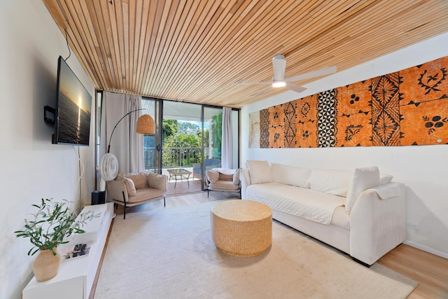 1875 Kalanianaole Ave Unit 311, Hilo, HI 96720 - living area with expansive windows, wood ceiling, wood finished floors, and ceiling fan