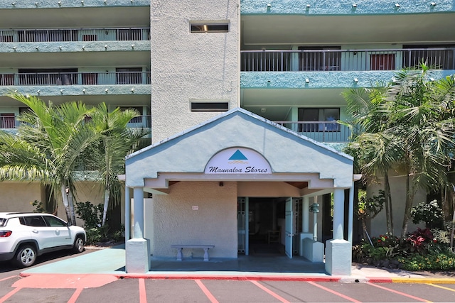 1875 Kalanianaole Ave Unit 311, Hilo, HI 96720 - view of property featuring uncovered parking