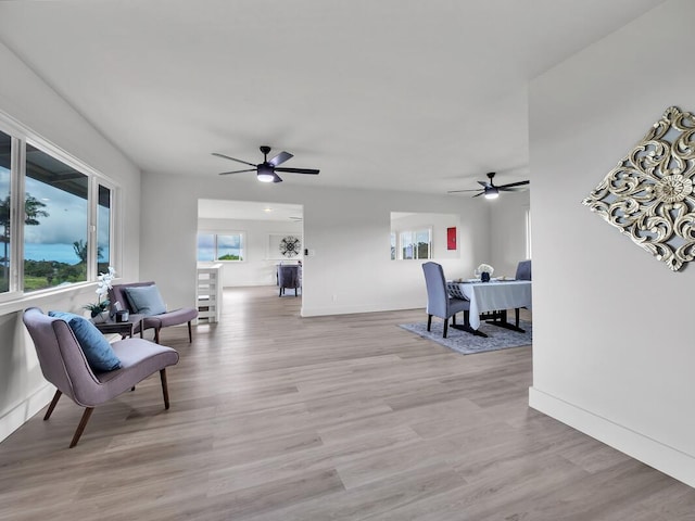 2427 Kaiwiki Rd, Hilo, HI 96720 - sitting room featuring a ceiling fan, an office area, baseboards, and light wood-style floors