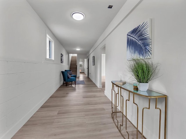 2427 Kaiwiki Rd, Hilo, HI 96720 - hallway with light wood-style flooring and stairs