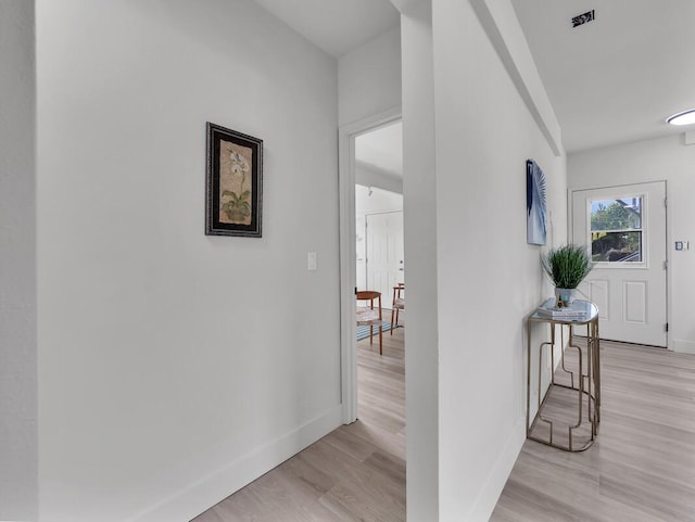 2427 Kaiwiki Rd, Hilo, HI 96720 - corridor featuring baseboards and light wood-style floors