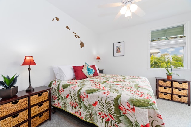 bedroom with a ceiling fan and carpet