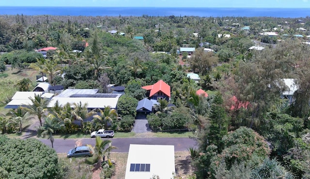 bird's eye view with a wooded view