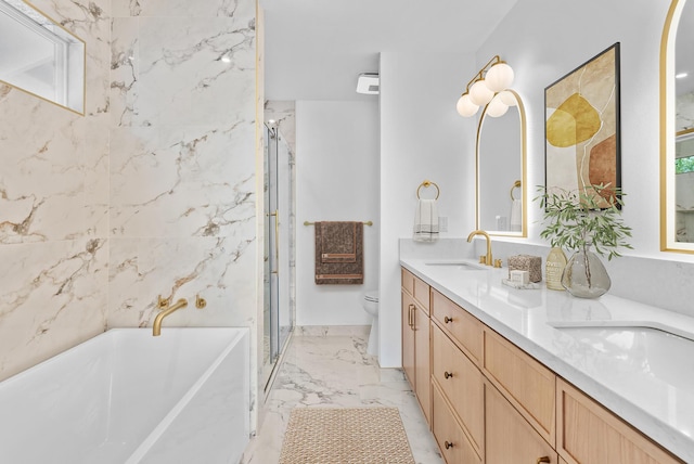 full bath featuring double vanity, toilet, a soaking tub, marble finish floors, and a stall shower