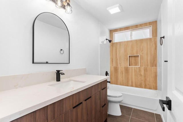 full bath featuring vanity, washtub / shower combination, tile patterned floors, and toilet