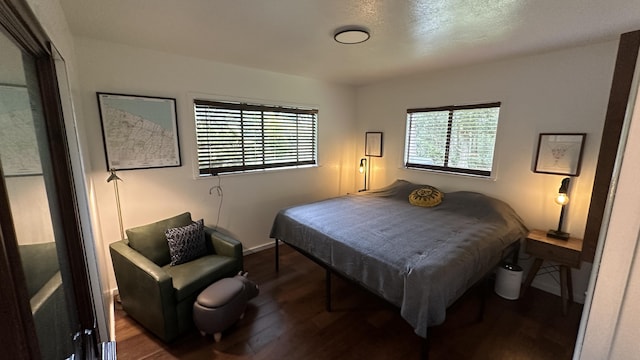 45-1181 Kalehua Rd, Honokaa, HI 96727 - bedroom featuring baseboards, multiple windows, and wood finished floors