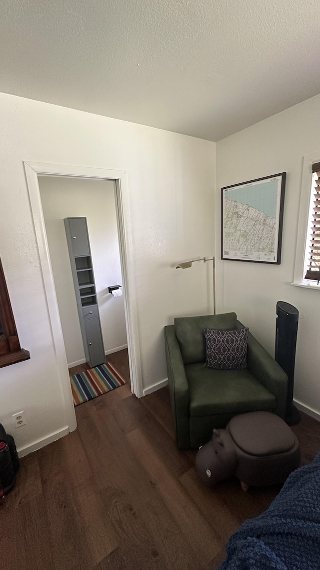 45-1181 Kalehua Rd, Honokaa, HI 96727 - living area featuring a textured ceiling, baseboards, and wood finished floors