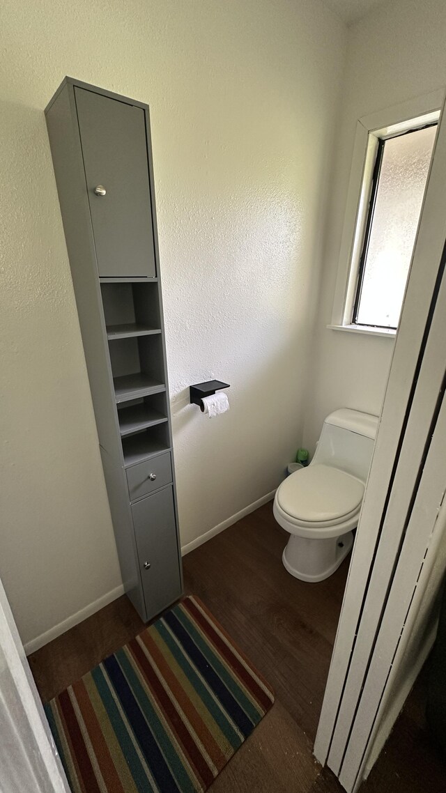 45-1181 Kalehua Rd, Honokaa, HI 96727 - bathroom featuring toilet, baseboards, and wood finished floors