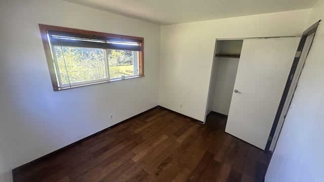 45-1181 Kalehua Rd, Honokaa, HI 96727 - unfurnished bedroom with dark wood-style flooring and a closet