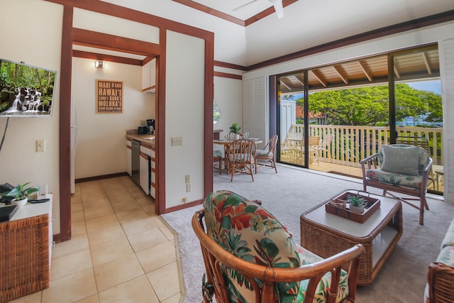 2253 Poipu Rd Unit 148, Koloa, HI 96756 - living room with light tile patterned floors, baseboards, and light colored carpet